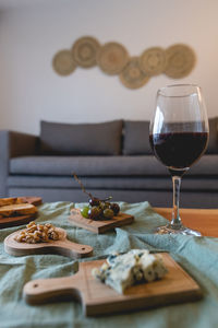 Close-up of wine in glass on table at home