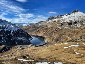 Scenic view of snowcapped mountains against sky