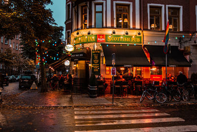 Illuminated city street at night