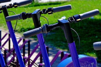 Close-up of bicycle parked on field