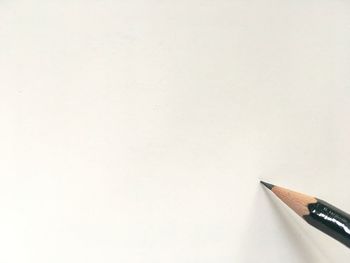 High angle view of pencils against white background