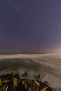 Scenic view of sea against sky at night