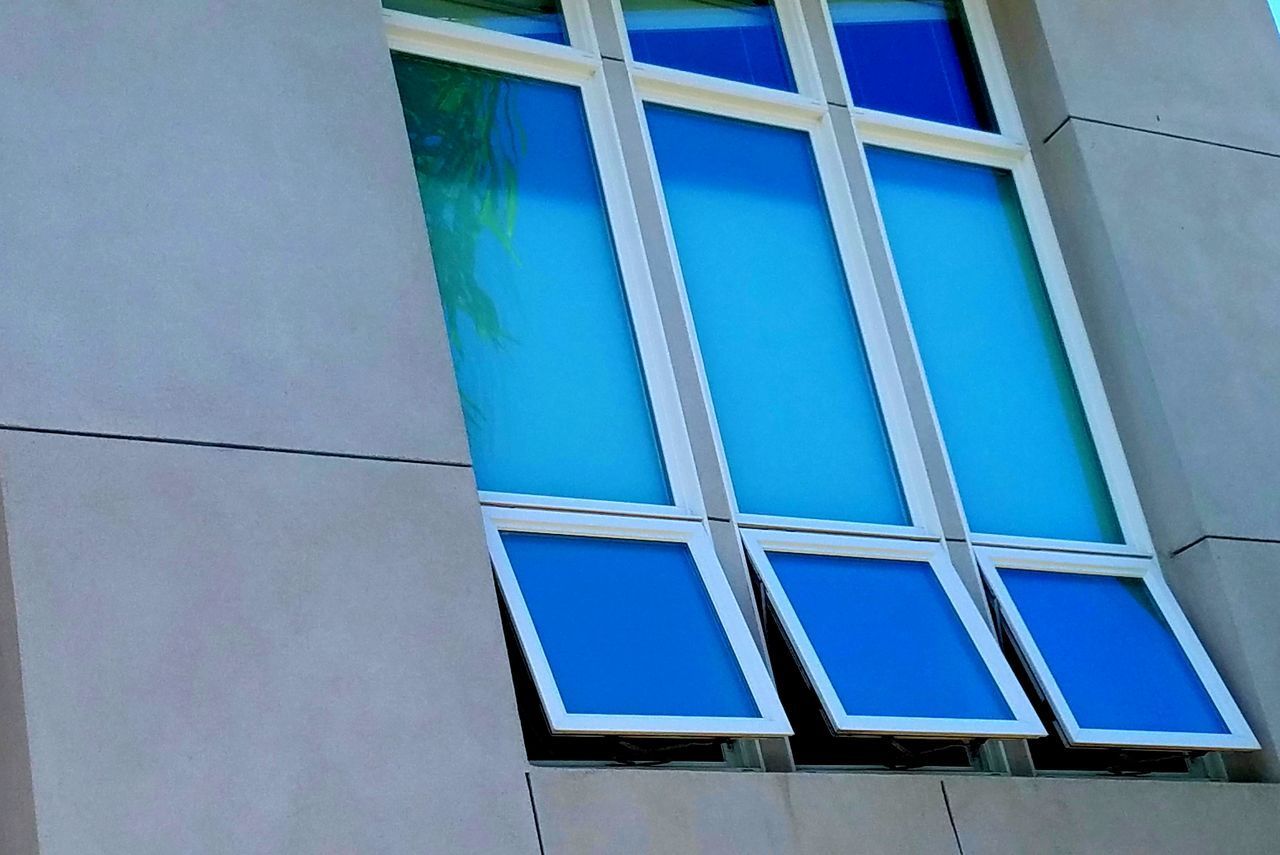 LOW ANGLE VIEW OF BLUE SKY WITH WINDOWS