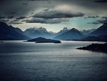 Scenic view of mountains against cloudy sky