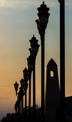 Low angle view of street light against sky during sunset