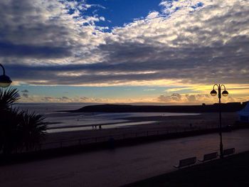 Scenic view of beach against sky during sunset