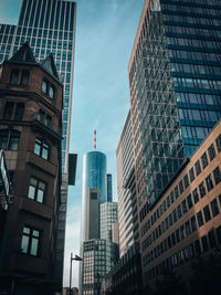 Low angle view of modern buildings in city against sky