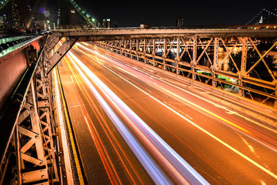 Illuminated bridge at night