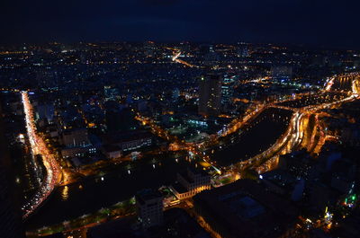 Aerial view of illuminated cityscape at night