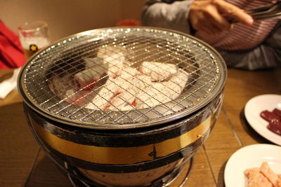 High angle view of metal grate on stove