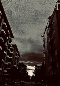Low angle view of buildings against sky at dusk