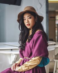 Portrait of smiling girl sitting at home