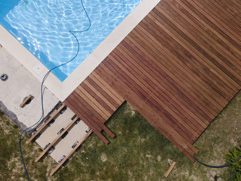 High angle view of wooden bench