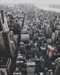 High angle view of modern buildings in city against sky