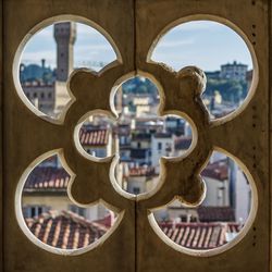 Buildings and sky seen through hole