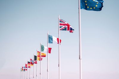 Low angle view of flag against clear sky