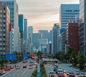 High angle view of traffic on road amidst buildings in city
