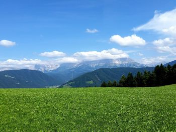 Scenic view of landscape against cloudy sky