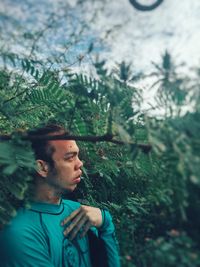 Portrait of young man looking away