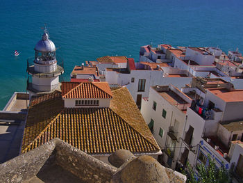 High angle view of townscape by sea