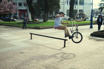 Man riding bicycle on street