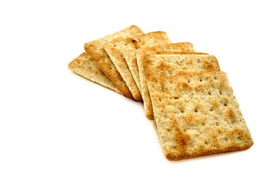 Close-up of bread against white background