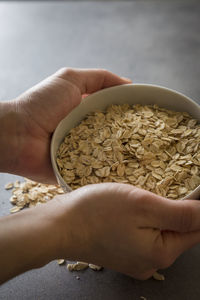 Close-up of hand holding bowl