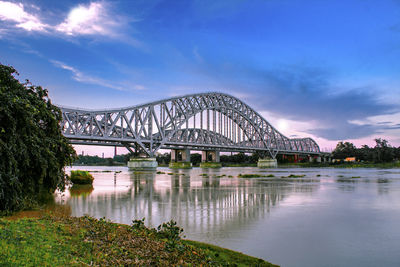 Bridge over river against sky