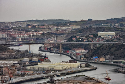 High angle view of river amidst buildings in city