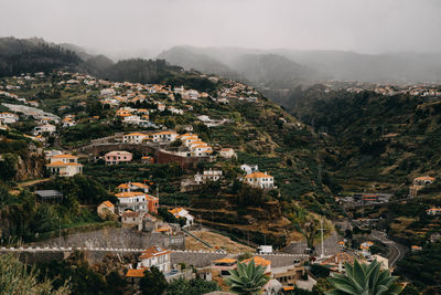 High angle view of townscape against mountains