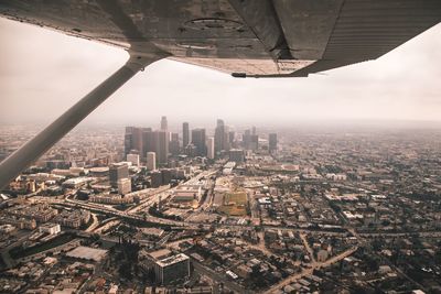 Aerial view of cityscape seen through airplane