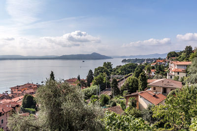 Panoramic view of townscape by sea against sky