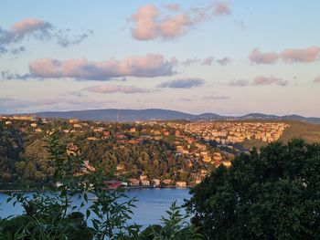 Scenic view of townscape against sky during sunset