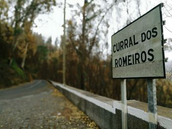 Close-up of signboard on road