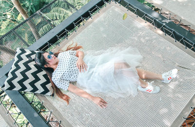 High angle view of baby lying on beach