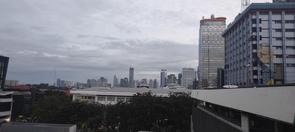 High angle view of buildings in city against sky