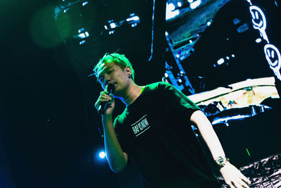 Full length of young man standing at night