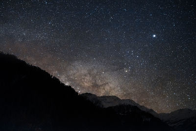 Andromeda galaxy photography at dramatic night sky with star trail