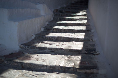 Shadow of people on staircase by building