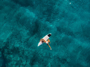 High angle view of man swimming in sea