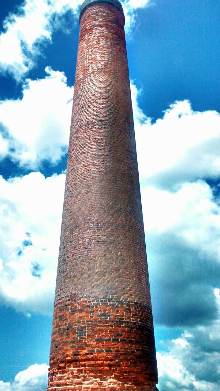 low angle view, sky, architecture, built structure, cloud - sky, cloud, smoke stack, building exterior, industry, factory, tower, cloudy, no people, blue, day, tall - high, outdoors, old, tall, metal