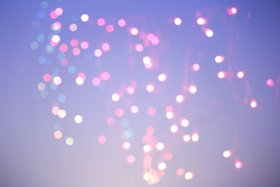 Defocused image of illuminated lights at night