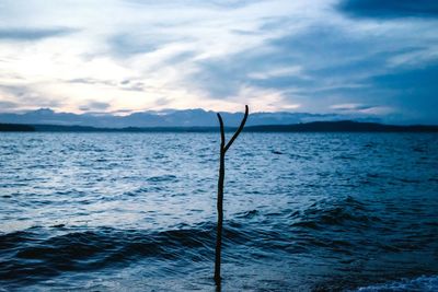 Scenic view of sea against cloudy sky