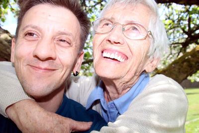 Close-up of cheerful mother and son