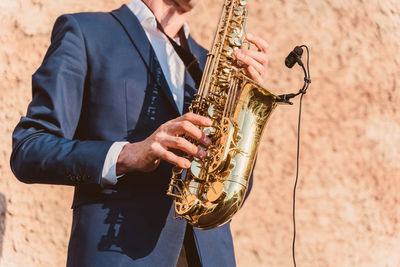 Cropped image of man playing guitar