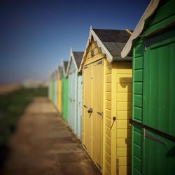 View of beach huts against sky