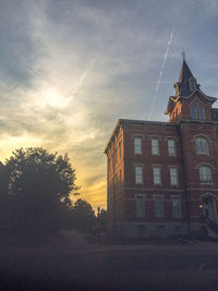 Low angle view of buildings against sky at dusk