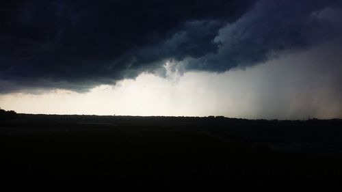 Landscape against cloudy sky