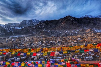 Aerial view of snowcapped mountains against sky