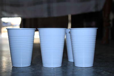 Close-up of wine glasses on table